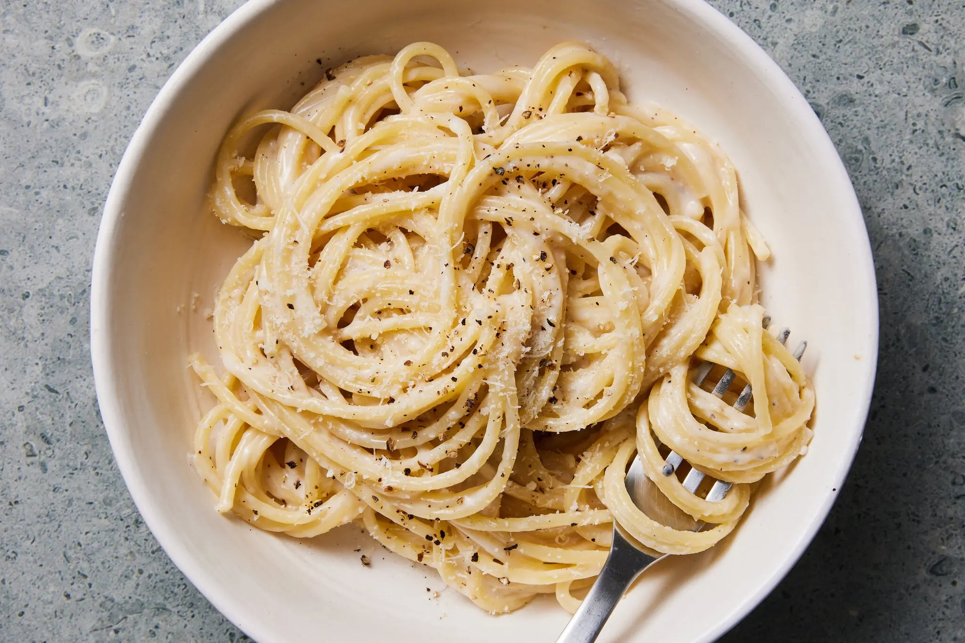 CACIO E PEPE TOPPED WITH GRILLED CHICKEN